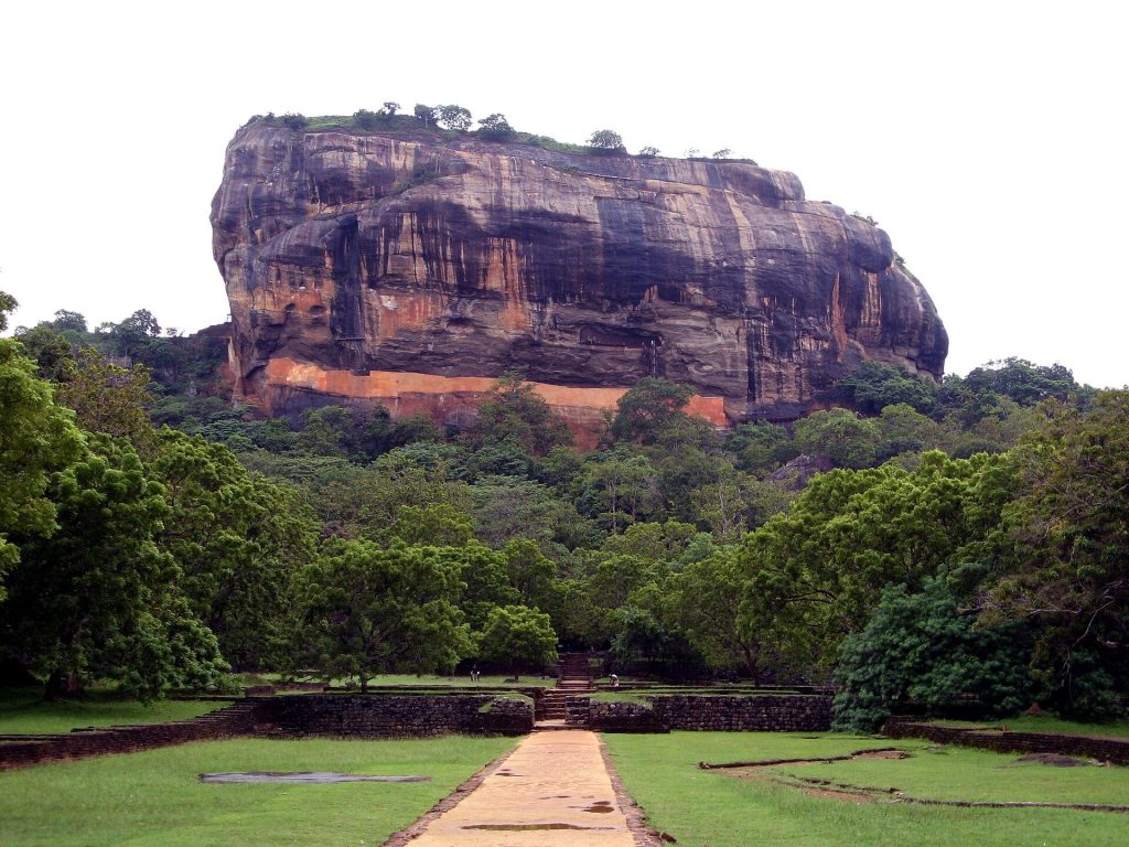 How to Get to Sigiriya from Colombo: Car, Train or Bus Sigiriya Rock seen from the path through the royal water gardens