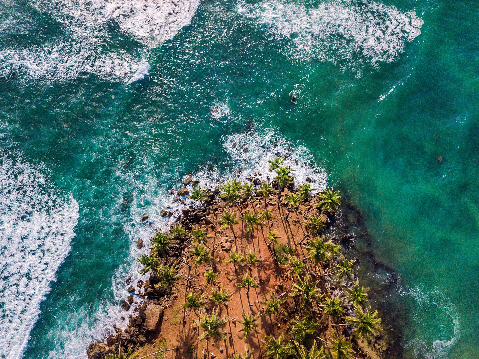 Aerial view of Coconut Tree Hill and turquoise sea in Mirissa, Sri Lanka