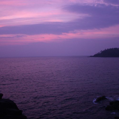Purple dusk over the ocean at Mirissa on a Sri Lanka beach honeymoon