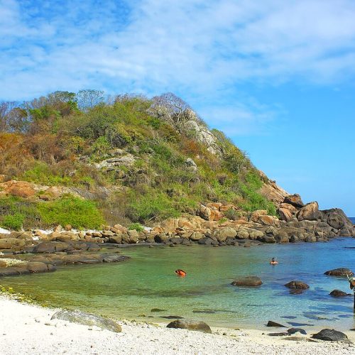 Beach and rocky hill on Pigeon Island near Nilaveli